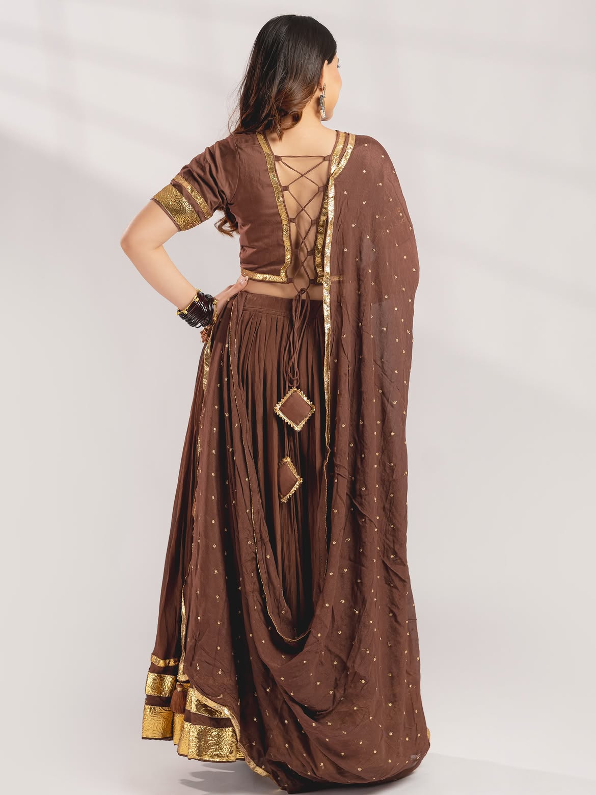 Earthy Chocolate Brown Crushed Lehenga Set with Gold Gota Borders & Tassel Accents